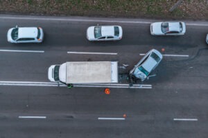 A truck accident lawyer using a calculator while determining the value of a rear-end truck accident.