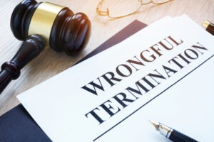 A piece of paper belonging to a San Francisco wrongful termination lawyer reads ‘wrongful termination.’