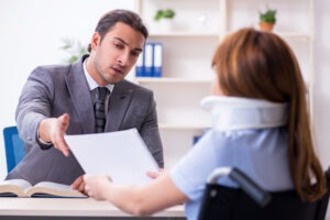 a-truck-accident-lawyer-speaking-with-a-client-about-negligence