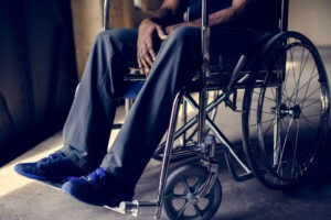 An old man in a wheelchair needs a Westchester nursing home abuse lawyer.