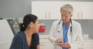 A woman speaks with an OBGYN healthcare provider. Contact a Los Angeles OBGYN malpractice lawyer.