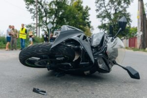 A motorcycle accident scene is depicted before someone calls a San Jose motorcycle accident lawyer.