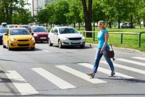 A woman crossing the street may need a San Francisco pedestrian accident lawyer.