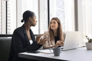 A lawyer sitting with a client and explaining what the charge of second-degree sexual assault entails.